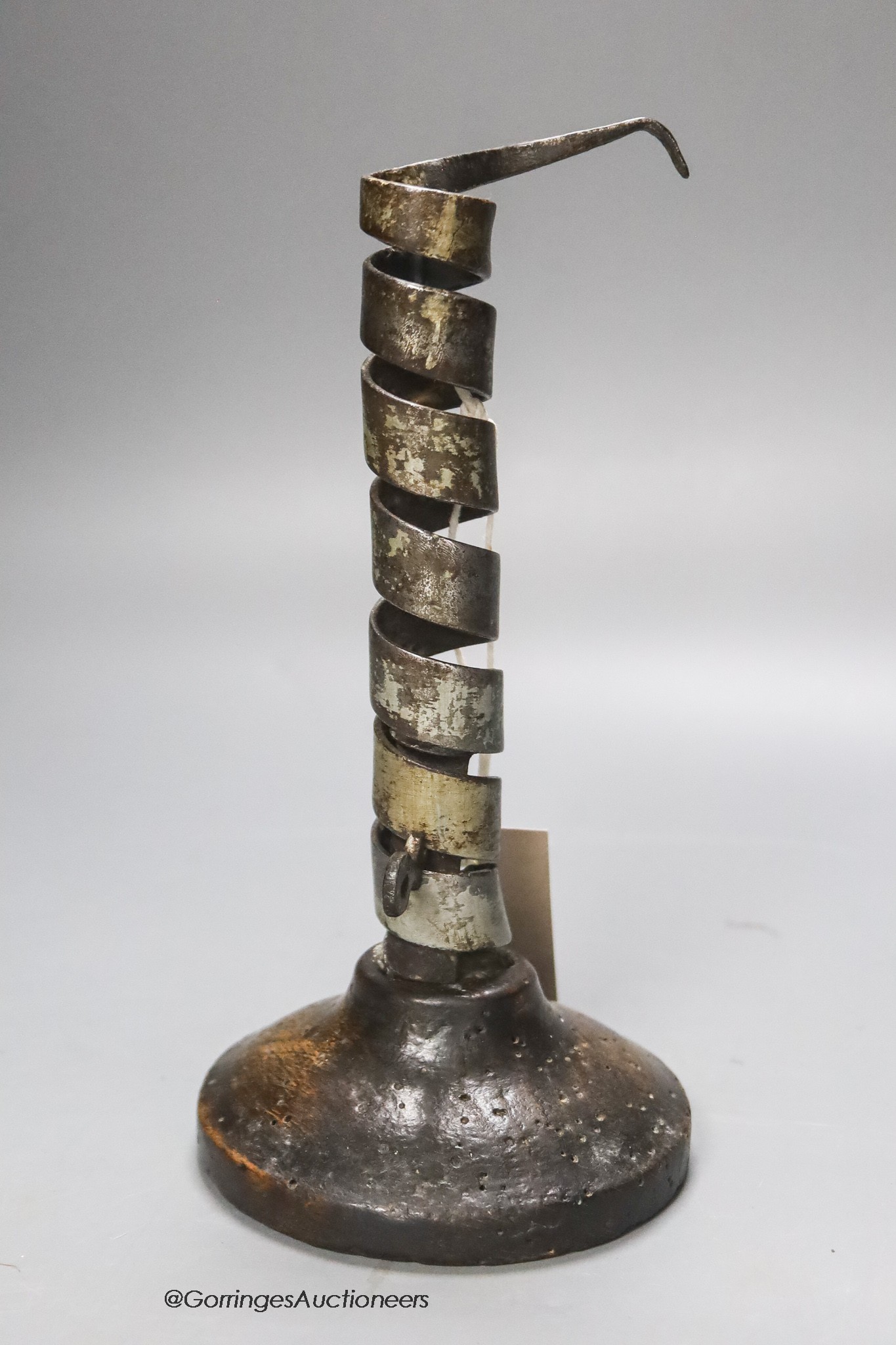 A late 17th century adjustable oak sheet-iron candlestick, height 20.5cm